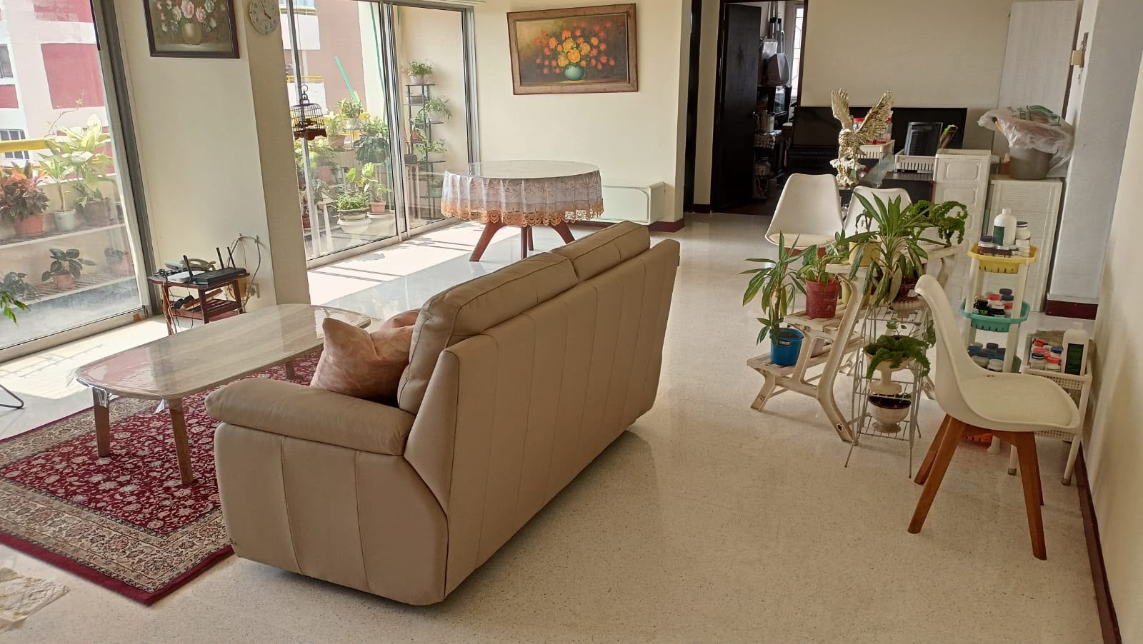 Terrazzo flooring beside the sofa and plants at Marine Vista